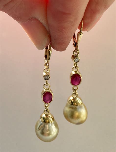 Diamond, ruby & south sea pearl earrings in 18k gold. | Pearl earrings, Earrings, South sea ...