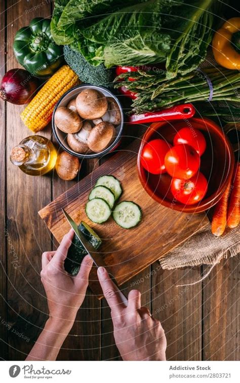 Vegetables and utensils on kitchen table - a Royalty Free Stock Photo ...