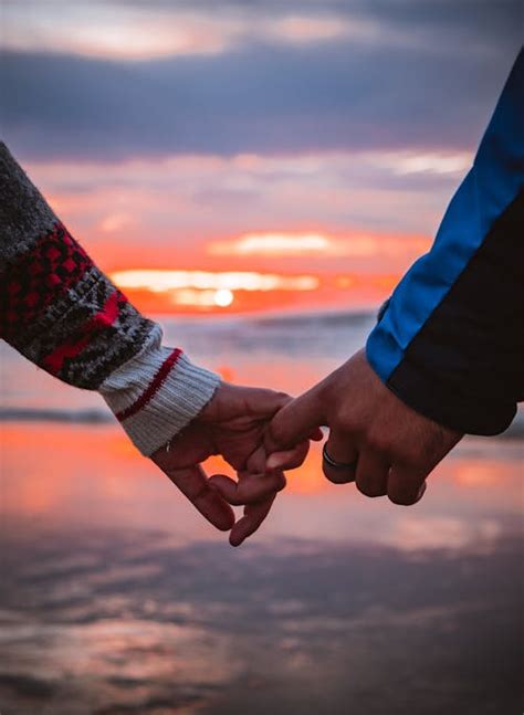 Two People Holding Hands · Free Stock Photo