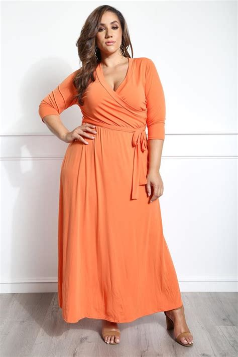 A plus size maxi dress with a wrapped V-neckline and 3/4 sleeves ...
