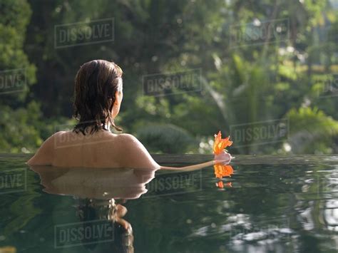 Woman; Woman Bathing In A Lake - Stock Photo - Dissolve