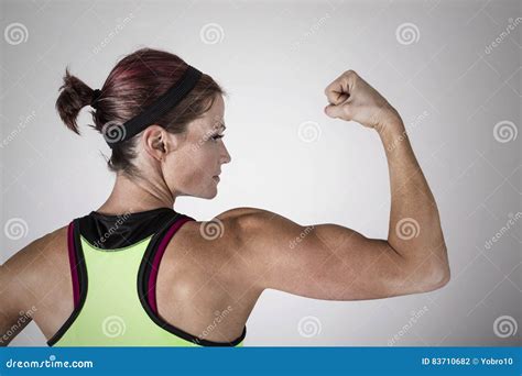 Strong Beautiful Fitness Woman Flexing Her Arm and Back Muscles Stock ...