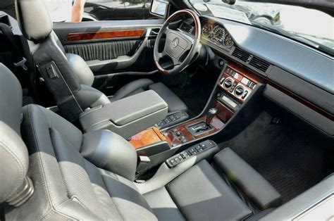 the interior of a car with leather and wood trim