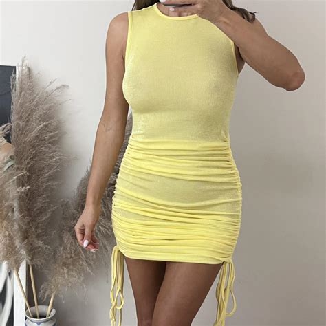 Lemon yellow mini dress. High neck tank style with... - Depop