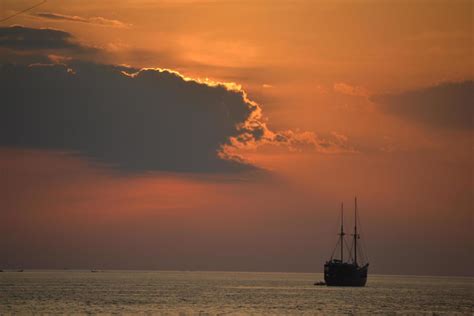 Silhouette of a boat at sunset 1271914 Stock Photo at Vecteezy