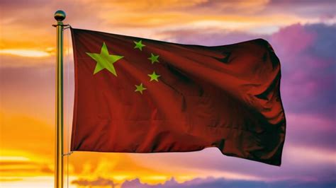 Premium Photo | China Waving Flag Against a Cloudy Sky