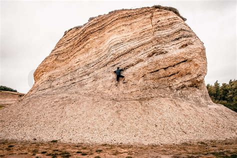 Man climbing a big rock | Stock image | Colourbox