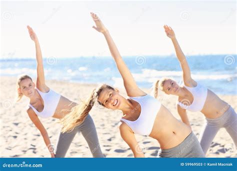 Group of Women Practising Yoga on the Beach Stock Image - Image of sport, beautiful: 59969503