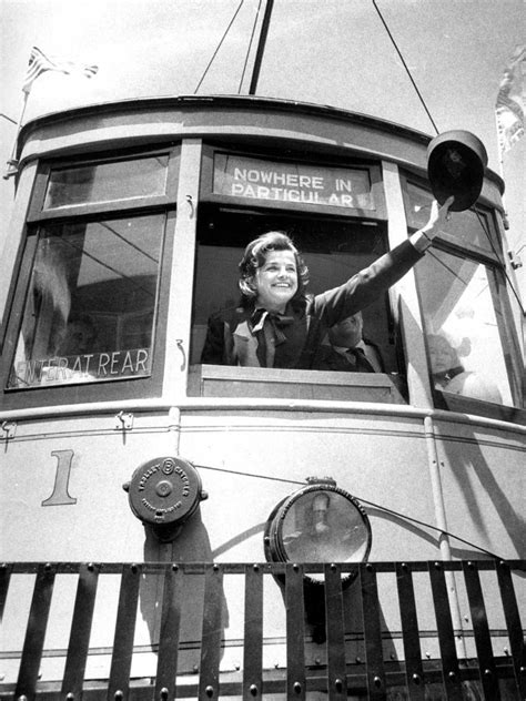 Mayor Dianne Feinstein waves a motorman's hat while standing in Muni Railway car 1 at the San ...