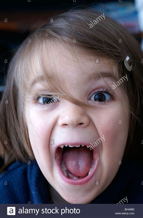 Happy child SHOUTING MOUTH OPEN happy children portraits Stock Photo, Royalty Free Image ...