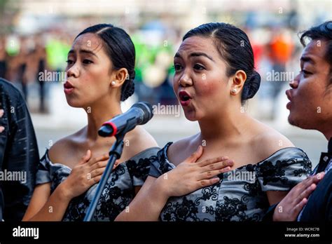 Young Filipinos Sing The National Anthem During The Dinagyang Festival, Iloilo City, Panay ...