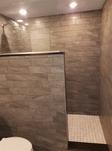 Tiled bathroom remodel. Large walk-in shower. Half wall, half glass ...