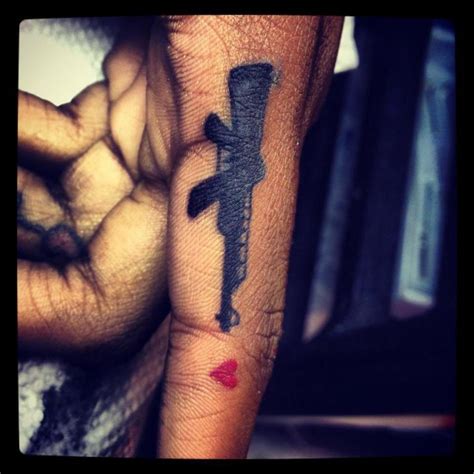 22 Adorable Gun Finger Tattoos