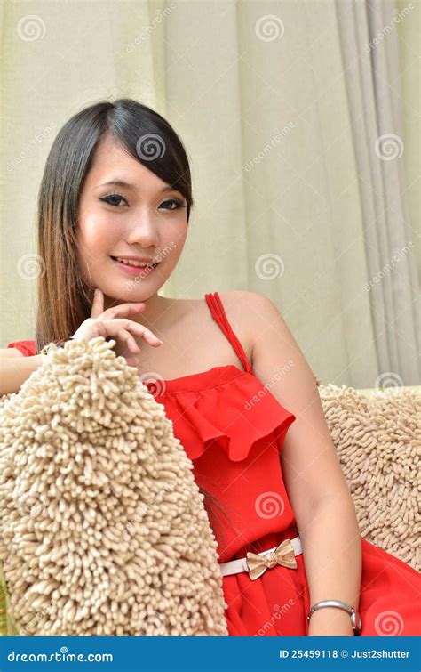 Beautiful Smiling Woman Sitting on Modern Sofa Stock Photo - Image of beautiful, home: 25459118
