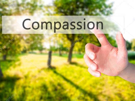 Compassion - Hand pressing a button on blurred background concep — Stock Photo © j.dudzinski ...