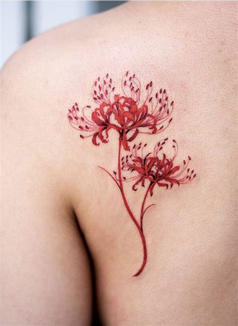 Oozy spider lily flower tattoo | Red ink tattoos, Lily flower tattoos, Red flower tattoos