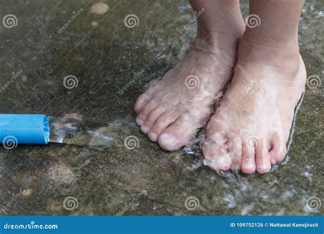 Closeup View of a Young Child`s Feet Splashing in Water from a R Stock Photo - Image of leisure ...