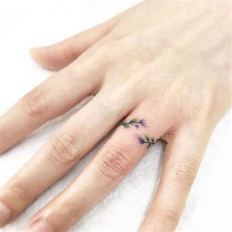 40 Ring Tattoos to Inspire Your Next Ink | Ring finger tattoos, Ring tattoo designs, Wedding ...