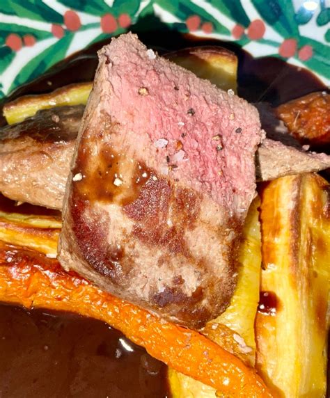 Venison Loin with a Red Wine and Juniper Sauce Served with Roasted Carrots and Parsnips