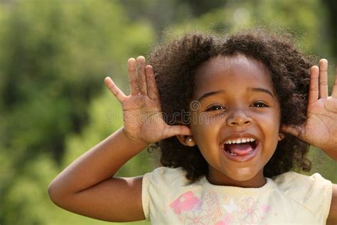 Playful Child. Happy African American child playing in a park , # ...