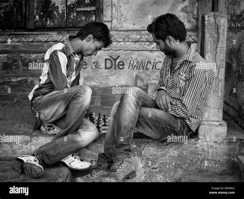 Two young men play chess on the street in Udaipur, Rajasthan, India Stock Photo - Alamy