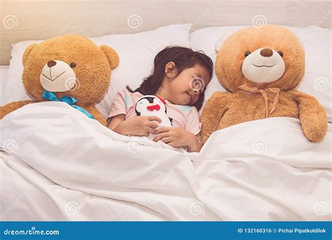 Little Girl Sleeping In Bed Hugging The Teddy Bear Stock Photo 174797 ...