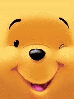 winnie the pooh is smiling with his tongue out