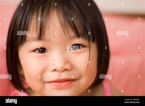 little asian girl with smiling face Stock Photo - Alamy