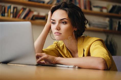 Portrait of Young Businesswoman Sitting at the Desk and Tiredly Working ...