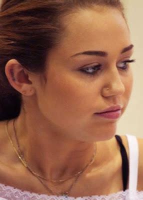 tattoo for girls: Designs Photos: Miley cyrus new ear tattoo design