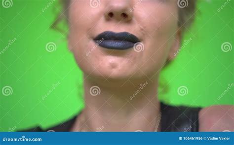 Close Up Front View of Pretty Caucasian Woman with Black Lipstick Smiling and Laughing on Green ...