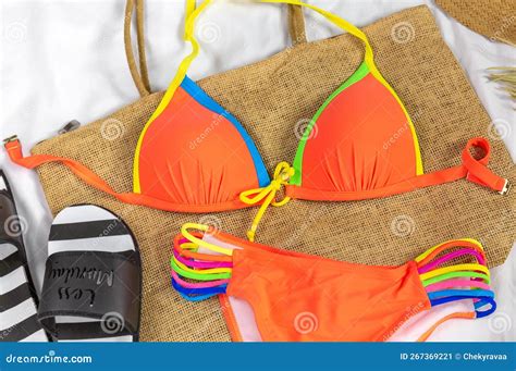 Orange Bikini, Straw Hat for the Beach Activities. Simple Basic Summer Women Clothes. Flat Lay ...