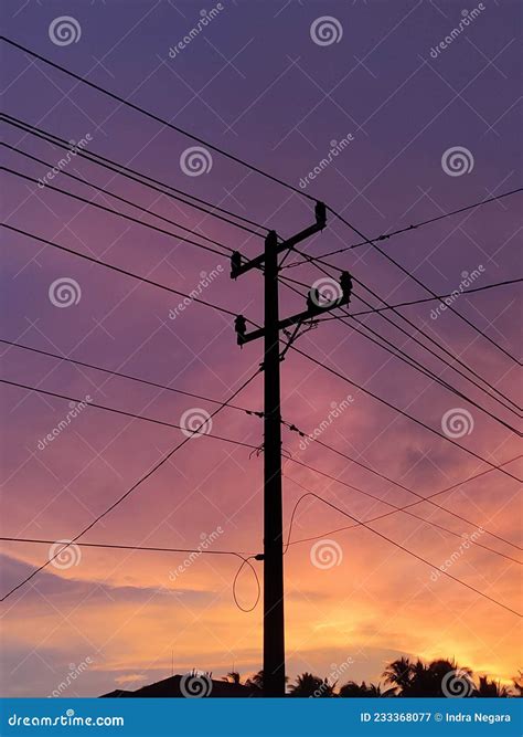 Photo of Electric Poles with Sunset Sky in the Background Stock Image ...