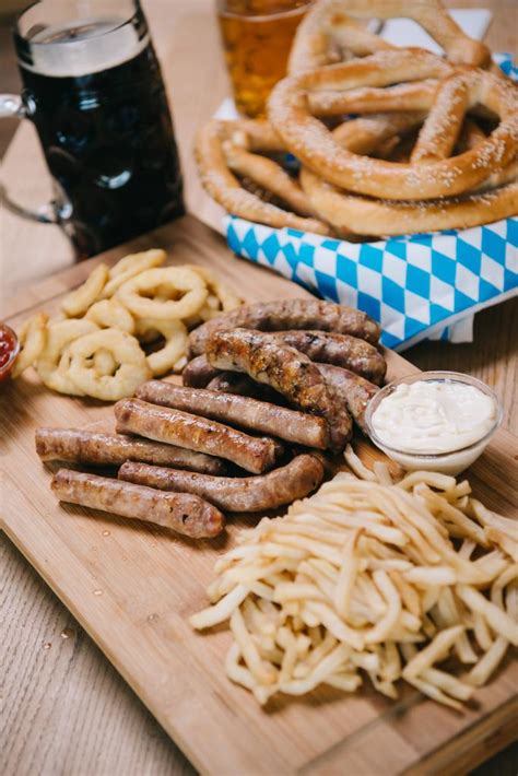 Fried Sausages, Onion Rings, French Fries, Pretzels Free Stock Photo and Image