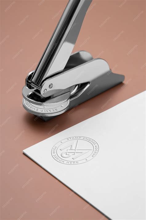 Premium PSD | Metallic stamp with embossed logo effect on paper