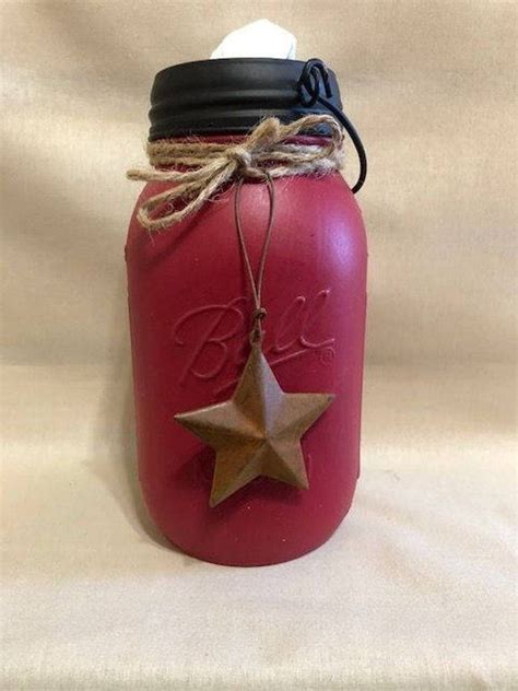 a red mason jar with a star on it