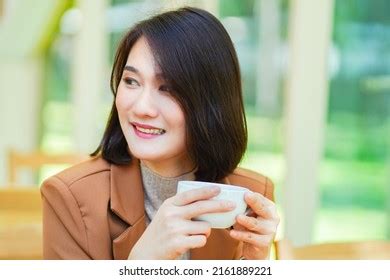 Closeup Womans Hand Sitting Desk Holding Stock Photo 2161889221 | Shutterstock