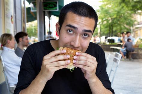 Restaurant eating | Person eating a burger at a restaurant. … | Flickr