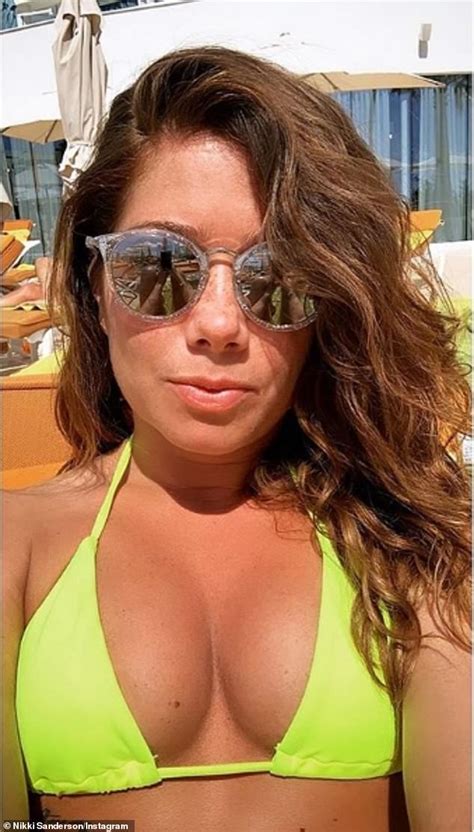 Nikki Sanderson flaunts her taut abs in a TINY neon bikini after split ...