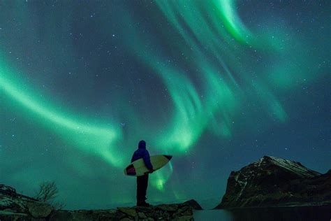 Stunning Photos: Surfing Under the Northern Lights Inside the Arctic Circle - Newsweek