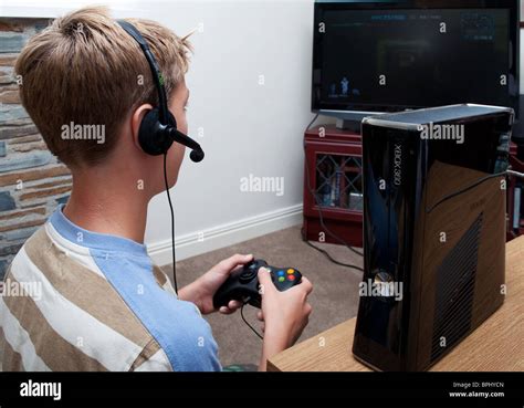 Boy playing on xbox hi-res stock photography and images - Alamy