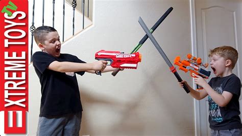 Ethan Vs. Cole Nerf Blasters and Nerf Sword Attack! - YouTube