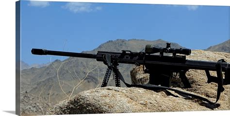 A Barrett .50-caliber M107 Sniper Rifle sits atop an observation point in Afghanistan Wall Art ...