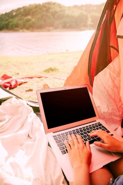 Free Photo | Person working on laptop outdoors