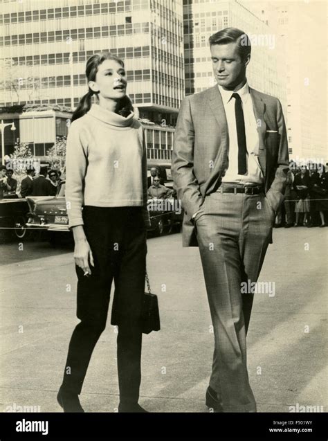 The actors Audrey Hepburn and George Peppard in a scene from the film Stock Photo: 89126631 - Alamy