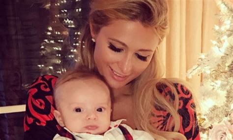 'Auntie Paris' Hilton cradles adorable baby at family Christmas dinner ...