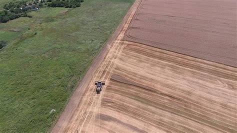 Premium Photo | Harvesting barley harvesters fields of wheat and barley the work of agricultural ...