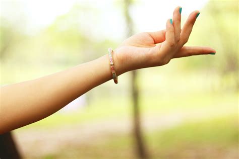 Close-Up Photography of Girl's Left Hand Wearing Bracelet · Free Stock ...