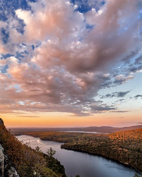 Evening sky over calm river flowing near forest · Free Stock Photo