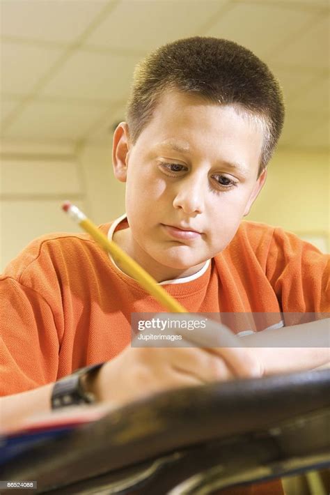 Boy Studying At Desk High-Res Stock Photo - Getty Images